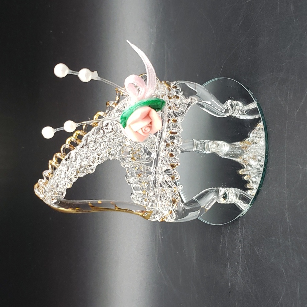 Hand made spun glass piano on a mirror base.